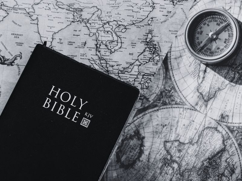Holy Bible on vintage world map background. Photo by Nothing Ahead from Pexels. Edited on Canva.